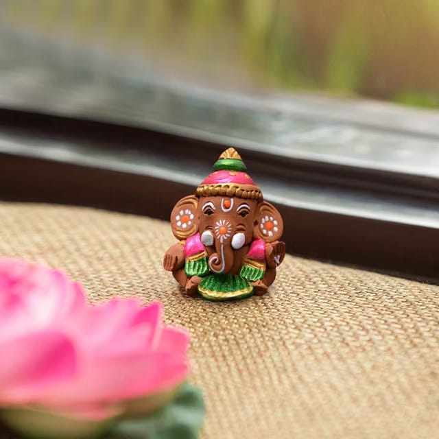 ExclusiveLane Terracotta Earthenware Handpainted Baby Car Ganesha -Idols and Figurines Showpieces Home Decor