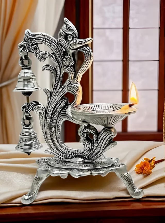 LABHCART Decorative Oil Lamp Diya Stand with Bells, Antique Silver Finish, Traditional Peacock Design